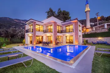 Villa Esma Sultan is a rental villa with sea views in Faralya, offering a peaceful atmosphere surrounded by nature.